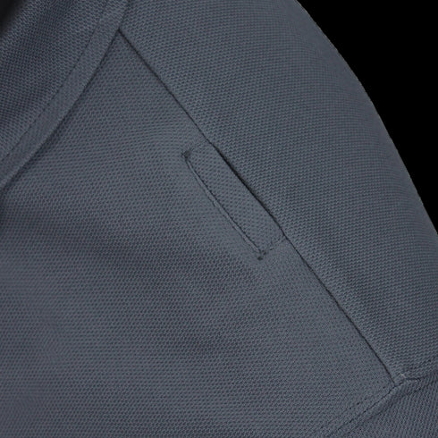 Close-up of the Condor Short Sleeve Performance Tactical Polo in dark gray, featuring a small rectangular welt pocket and visible stitching—designed for durability, ideal for First Responder or Military uniforms.